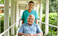 caregiver and patient on a wheelchair